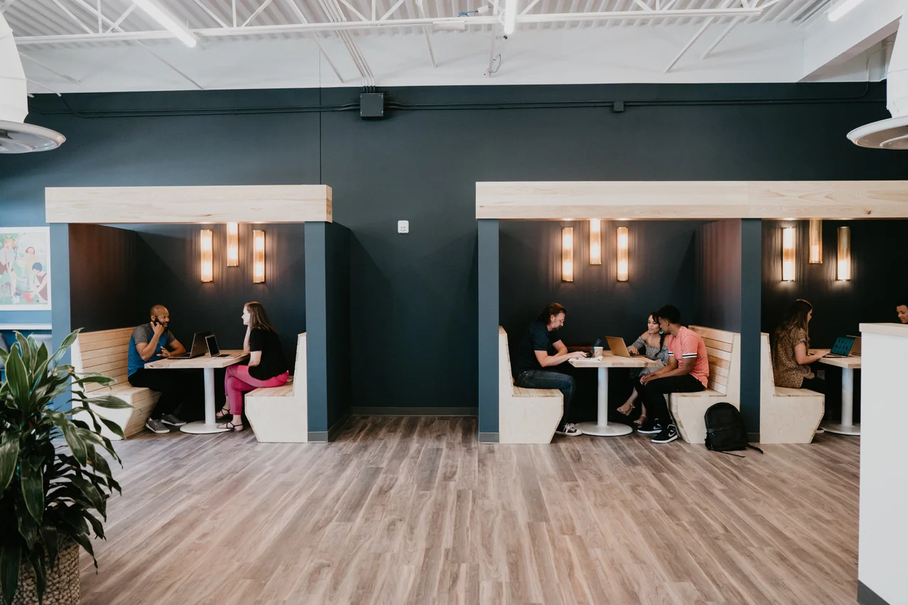 Coworking booths and open work areas at The Commons