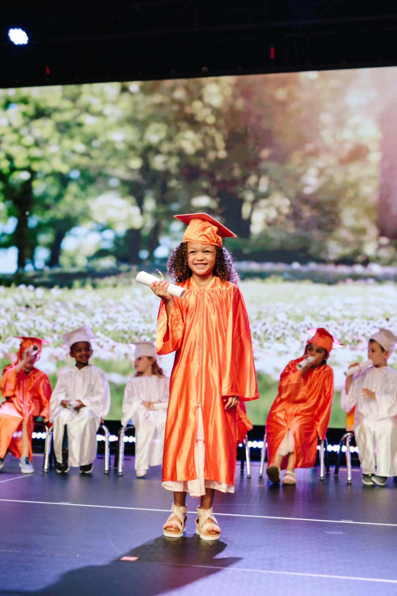 A child celebrating graduation from an amazing preschool in Alpharetta, Georgia.